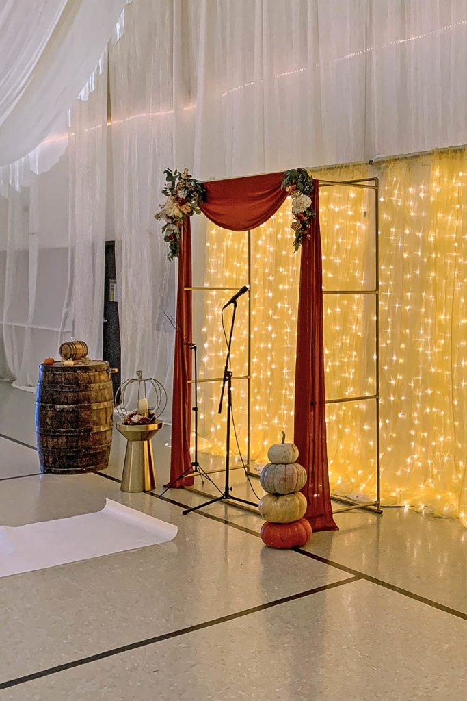 Sami and Donny had a Fall and Gold theme for their wedding. Here is the Gold Ceremony Arch and Gold Lighted Ceremony Backdrop from Smiling Dog Entertainment.