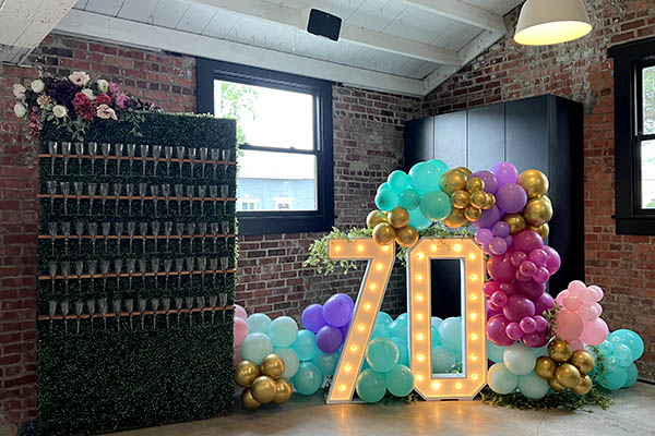 Balloons, Champagne Wall, and Lighted Numbers